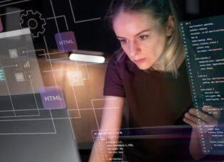 Web designer creating website layout with development code on screen